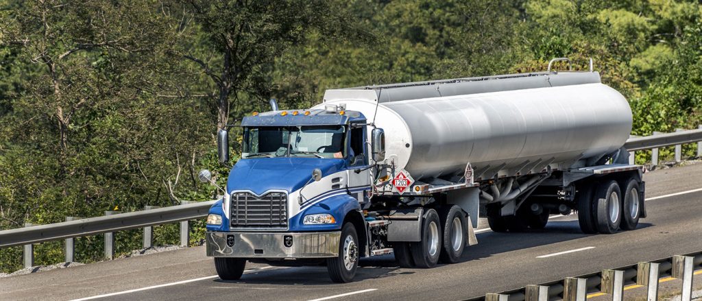 blue semi truck with tanker trailer